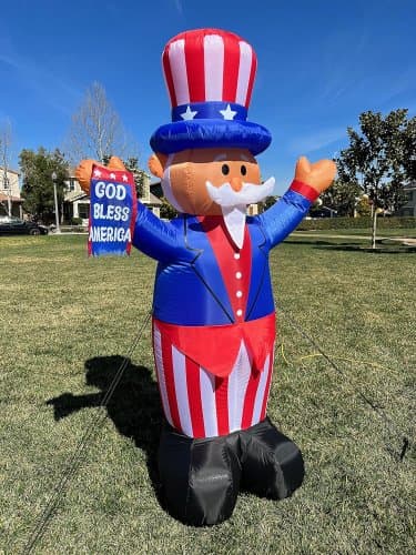 Bandera inflable del tio Sam con Dios bendiga de USA